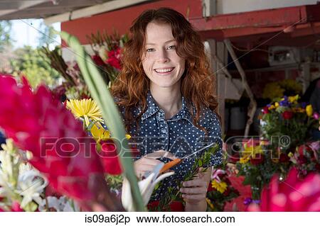 Stock Photography - Florist working in shop. Fotosearch