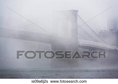 Fog rolling over Brooklyn bridge View Large Photo Image Stock Photograph - Fog rolling over Brooklyn bridge. Fotosearch