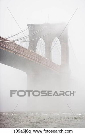 Fog rolling over Brooklyn bridge View Large Photo Image Stock Photography - Fog rolling over Brooklyn bridge. Fotosearch