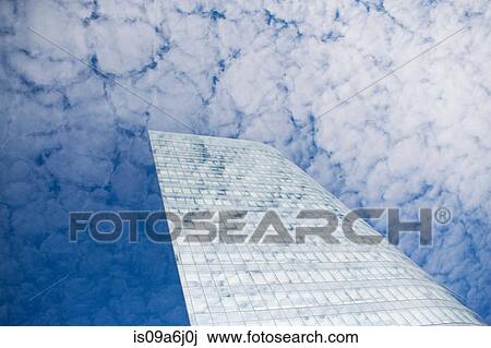 Glass skyscraper and cloudy sky View Large Photo Image Stock Image - Glass skyscraper and cloudy sky. Fotosearch