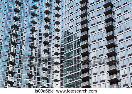 Stock Image - Glass skyscrapers on city street. Fotosearch