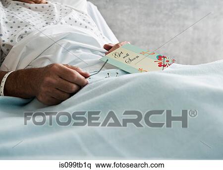 Hospital patient with get well soon card View Large Photo Image Stock Photography - Hospital patient with get well soon card. Fotosearch