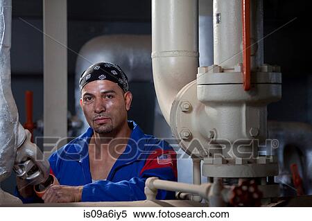 Stock Photography - Industrial worker in plant. Fotosearch