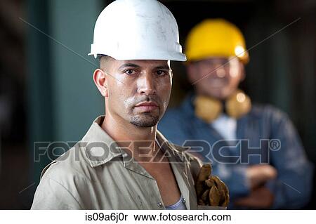 Stock Photography - Industrial worker in plant. Fotosearch