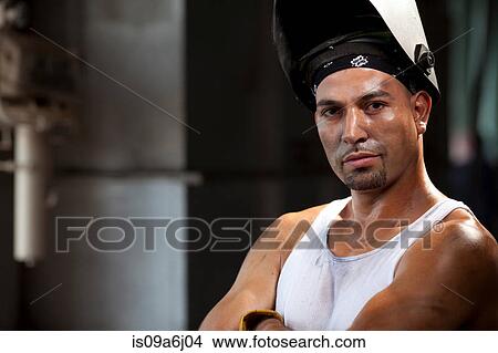 Picture - Industrial worker in welding helmet. Fotosearch