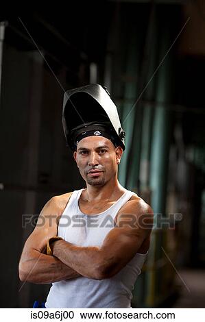 Industrial worker in welding helmet View Large Photo Image Stock Image - Industrial worker in welding helmet. Fotosearch