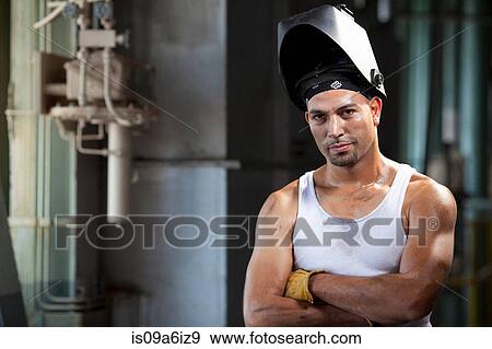 Industrial worker in welding helmet View Large Photo Image Stock Photo - Industrial worker in welding helmet. Fotosearch