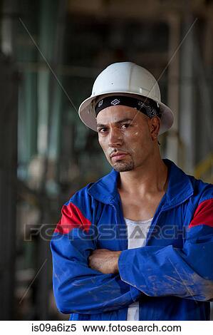 Industrial worker standing in plant View Large Photo Image Stock Photography - Industrial worker standing in plant. Fotosearch