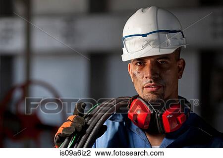 Industrial worker with wires in plant View Large Photo Image Stock Image - Industrial worker with wires in plant. Fotosearch