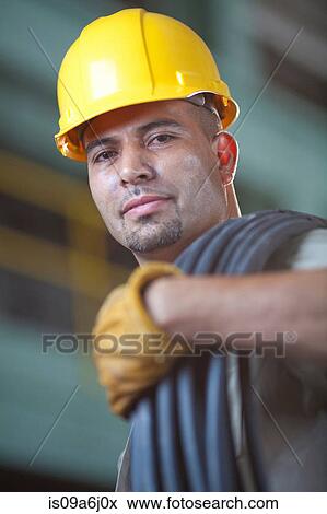 Stock Photo - Industrial worker with wires in plant. Fotosearch