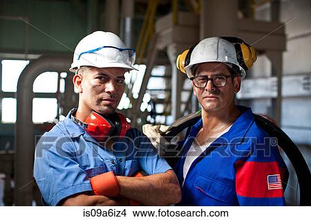 Picture - Industrial workers in plant. Fotosearch