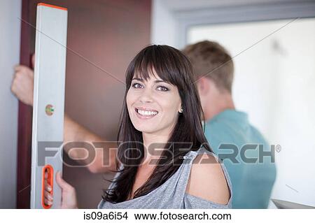 Picture - Interior designer smiling in home. Fotosearch