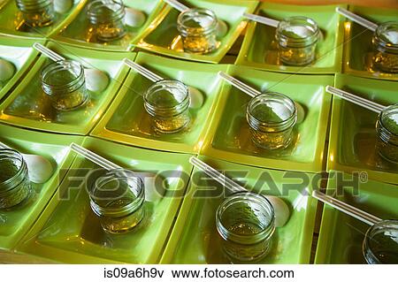 Jars and spoons in square bowls View Large Photo Image Stock Photo - Jars and spoons in square bowls. Fotosearch