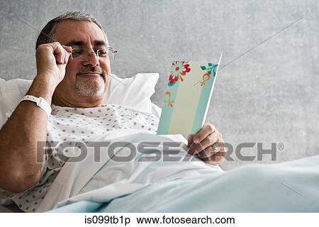 Male hospital patient looking at get well soon card View Large Photo Image Stock Photography - Male hospital patient looking at get well soon card. Fotosearch