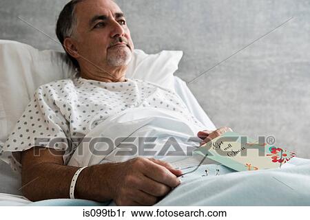 Male hospital patient with get well soon card View Large Photo Image Stock Photography - Male hospital patient with get well soon card. Fotosearch