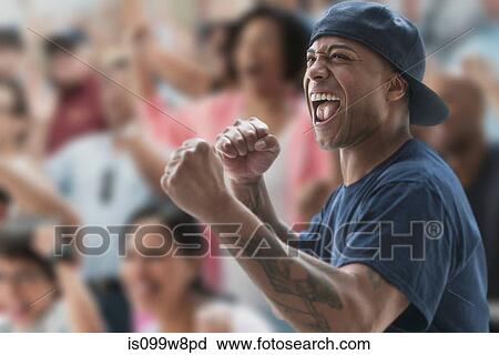 Man cheering at sports game View Large Photo Image Stock Image - Man cheering at sports game. Fotosearch