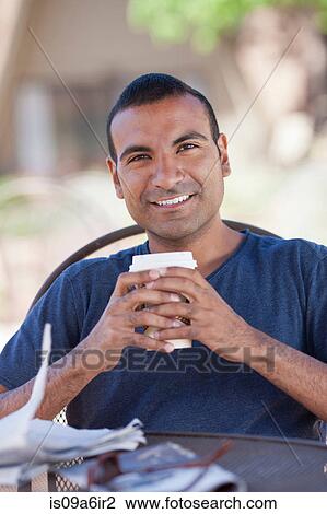 Man having cup of coffee outdoors View Large Photo Image Stock Image - Man having cup of coffee outdoors. Fotosearch