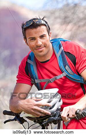 Man sitting on mountain bike View Large Photo Image Stock Image - Man sitting on mountain bike. Fotosearch