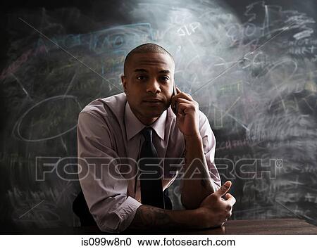 Stock Image - Man using cell phone. Fotosearch