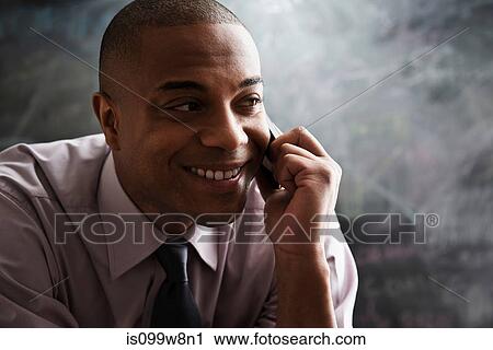 Man using cell phone View Large Photo Image Stock Image - Man using cell phone. Fotosearch