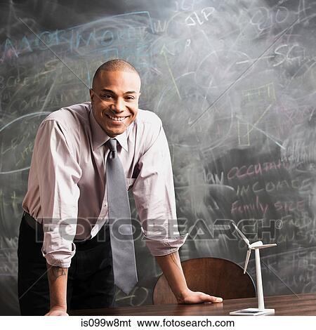 Man with model wind turbine View Large Photo Image Stock Photograph - Man with model wind turbine. Fotosearch