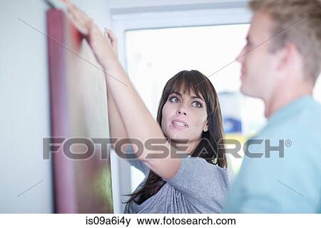 Stock Photo - Man working with interior designer. Fotosearch