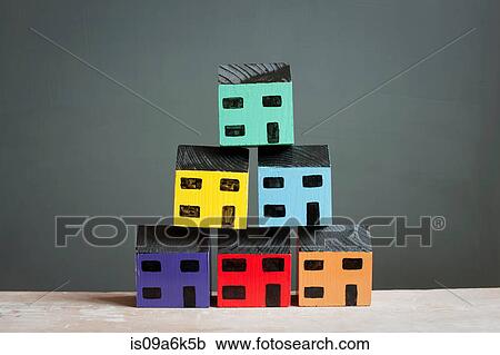 Stock Image - Model houses stacked together. Fotosearch