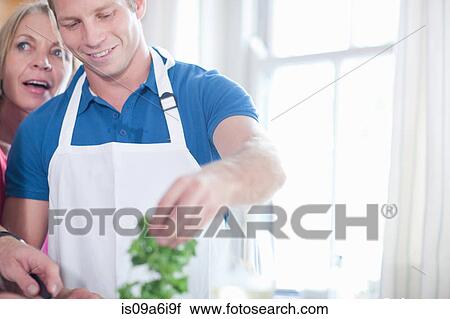 Mother and son cooking in kitchen View Large Photo Image Stock Image - Mother and son cooking in kitchen. Fotosearch
