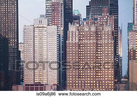 Stock Photograph - New York City skyscrapers at sunset. Fotosearch