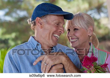 Stock Photograph - Older couple gardening together. Fotosearch