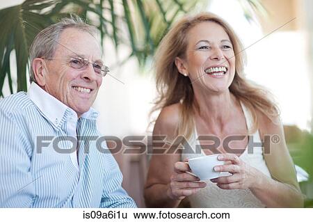 Stock Photograph - Older couple having coffee together. Fotosearch