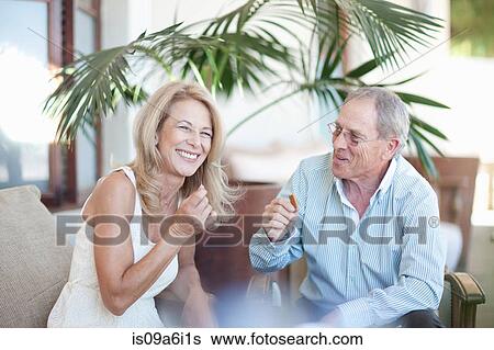 Older couple relaxing together View Large Photo Image Stock Photograph - Older couple relaxing together. Fotosearch