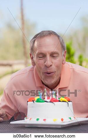 Older man blowing birthday candles View Large Photo Image Stock Image - Older man blowing birthday candles. Fotosearch
