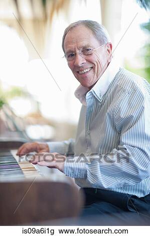 Older man playing piano View Large Photo Image Stock Image - Older man playing piano. Fotosearch