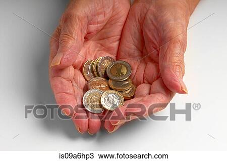 Older woman holding Euro coins View Large Photo Image Stock Image - Older woman holding Euro coins. Fotosearch