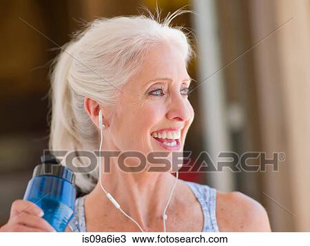 Older woman working out at home View Large Photo Image Stock Image - Older woman working out at home. Fotosearch