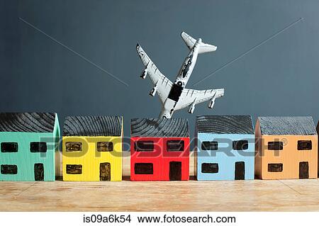 Plane crashing into model house View Large Photo Image Picture - Plane crashing into model house. Fotosearch