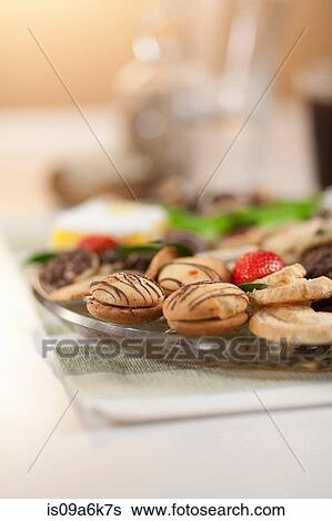 Plate of decorated cookies on table View Large Photo Image Stock Photograph - Plate of decorated cookies on table. Fotosearch