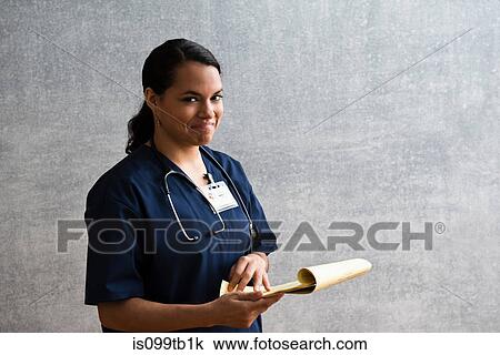 Portrait of hospital nurse with clipboard View Large Photo Image Stock Image - Portrait of hospital nurse with clipboard. Fotosearch
