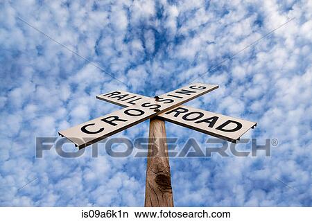 'Railroad crossing' sign under blue sky View Large Photo Image Picture - 'Railroad crossing' sign under blue sky. Fotosearch