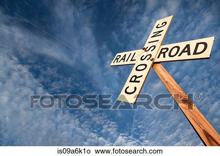 'Railroad crossing' sign under blue sky View Large Photo Image Picture - 'Railroad crossing' sign under blue sky. Fotosearch