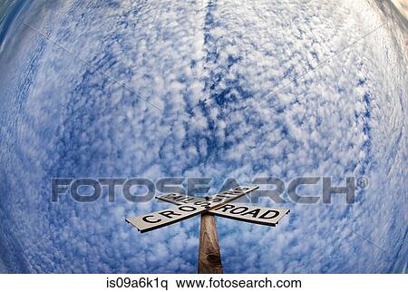 'Railroad crossing' sign under blue sky View Large Photo Image Stock Photography - 'Railroad crossing' sign under blue sky. Fotosearch