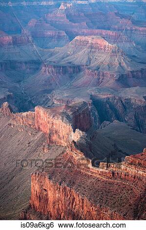 Stock Photograph - Rock formations in dry desert landscape. Fotosearch