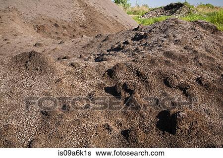 Sand and earth in piles after rainfall View Large Photo Image Stock Photograph - Sand and earth in piles after rainfall. Fotosearch
