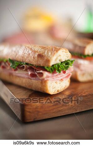 Stock Photograph - Sandwiches on cutting board. Fotosearch