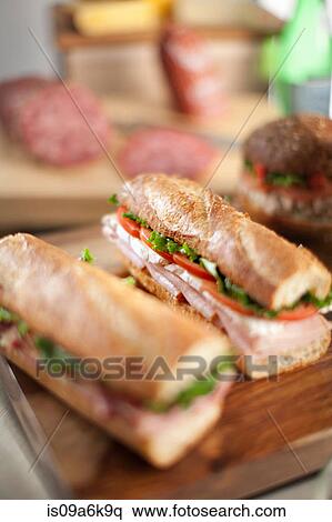 Sandwiches on cutting board View Large Photo Image Stock Photography - Sandwiches on cutting board. Fotosearch
