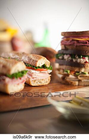Sandwiches on cutting board View Large Photo Image Stock Photography - Sandwiches on cutting board. Fotosearch