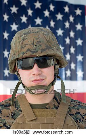Serviceman in camouflage by US flag View Large Photo Image Stock Image - Serviceman in camouflage by US flag. Fotosearch