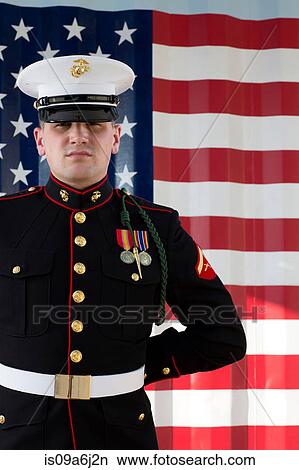 Serviceman in dress blues by US flag View Large Photo Image Picture - Serviceman in dress blues by US flag. Fotosearch