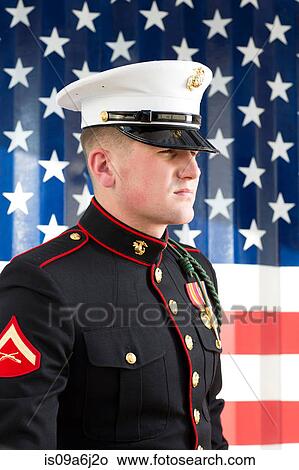 Serviceman in dress blues by US flag View Large Photo Image Picture - Serviceman in dress blues by US flag. Fotosearch